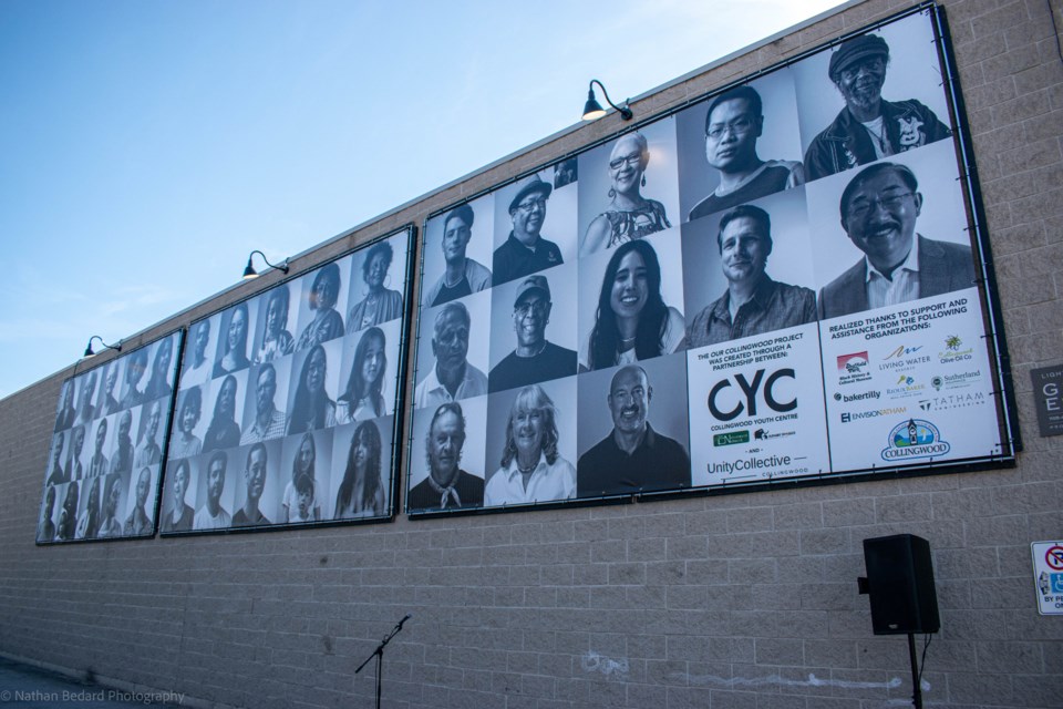 The 60-foot-long Our Collingwood mural is mounted to the wall of the Fathom  Boards building. 