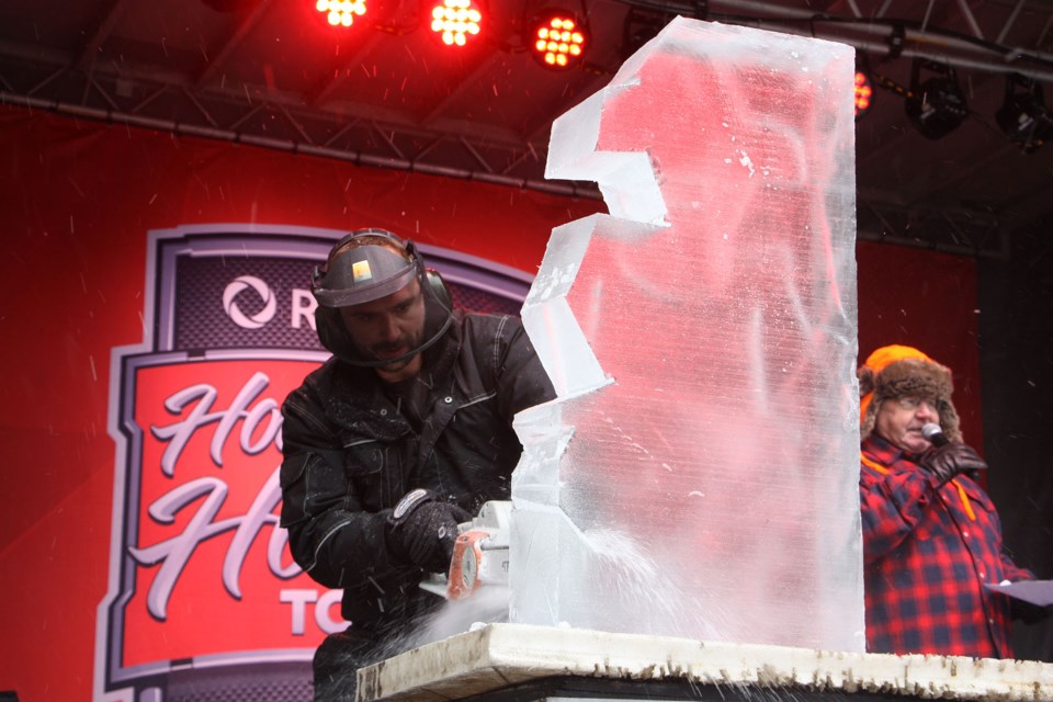 Thomas Grass works on the preliminary cuts for his competition ice sculpture. Erika Engel/CollingwoodToday