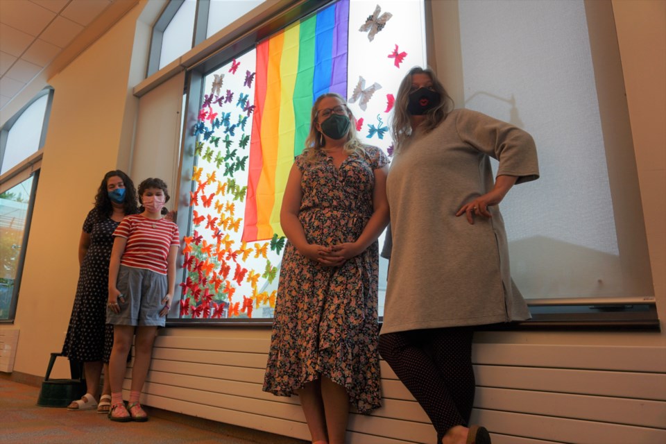 The Collingwood Public Library challenged teens to craft butterflies, which are now displayed in a rainbow formation in their windows, in honour of Collingwood Pride.