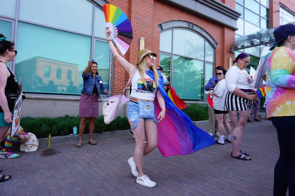 About 100 people attended a demonstration outside of the Collingwood Public Library on Friday to support library staff and families attending a drag queen story time event.