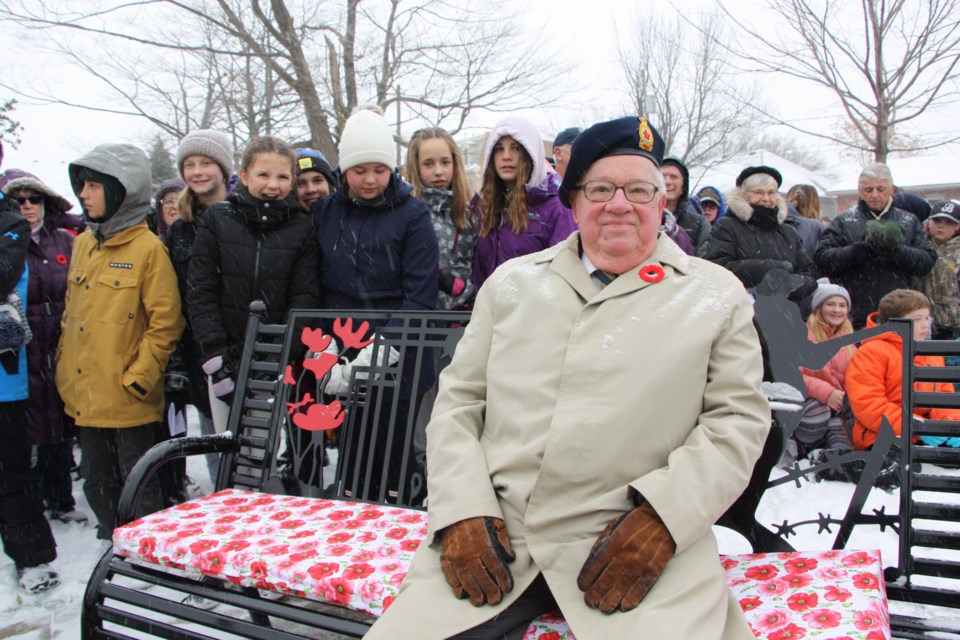 Don Wilcox, veteran and Legion Branch 62 member, sits on one of the Remembrance Day benches before the cenotaph service on Nov. 11. Heâs surrounded by youth attending the service at the Collingwood cenotaph. Erika Engel/CollingwoodToday
