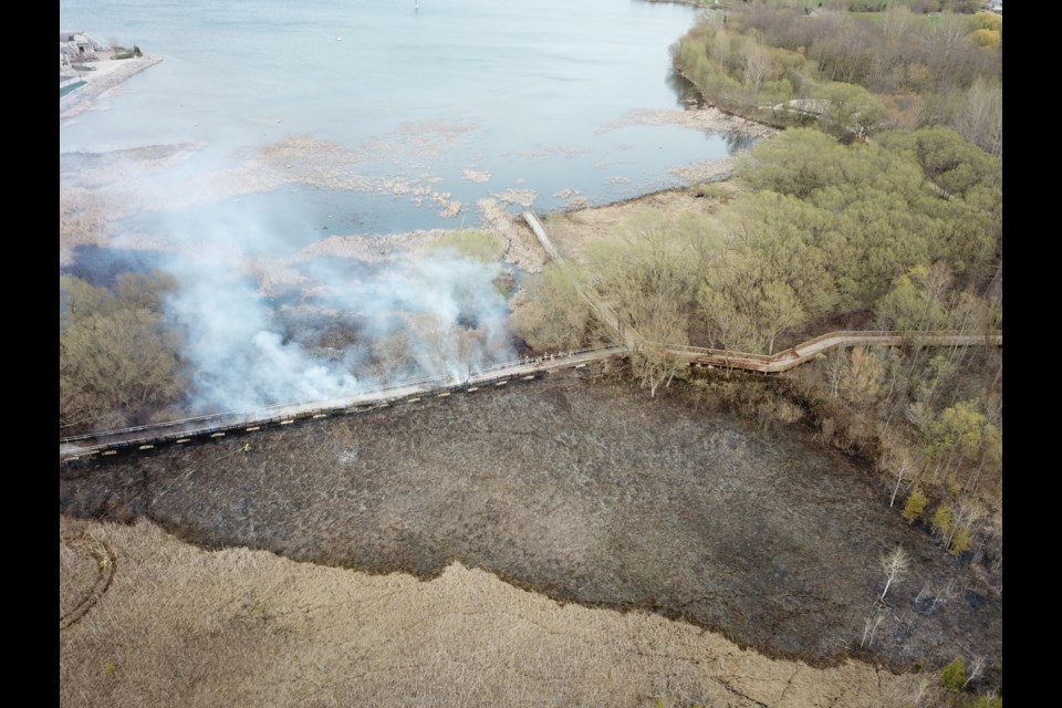 A fire broke out along the waterfront at Collingwood's west end on May 9, consuming 100 feet of boardwalk trail. Stuart Snelgrove for CollingwoodToday 