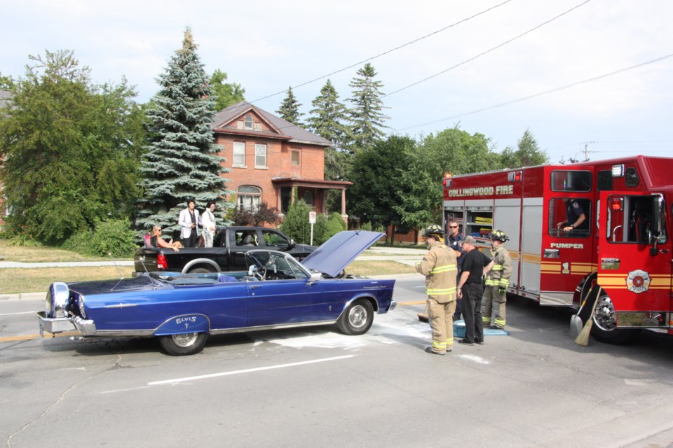 A blue Ford Galaxie 500 caught fire during the Collingwood Elvis Festival Classic Car Parade this morning. Erika Engel/CollingwoodToday