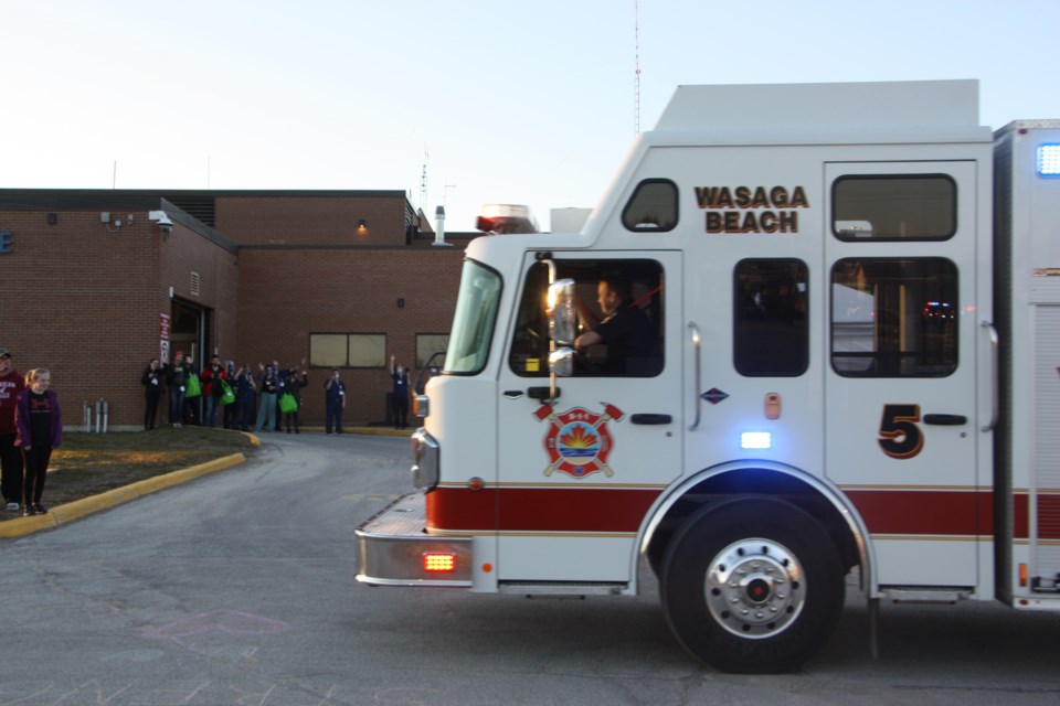 Fire trucks from Collingwood, Clearview, Wasaga Beach, and The Blue Mountains paraded past the hospital with sirens blaring on April 2 at 7:30 p.m. Erika Engel/CollingwoodToday