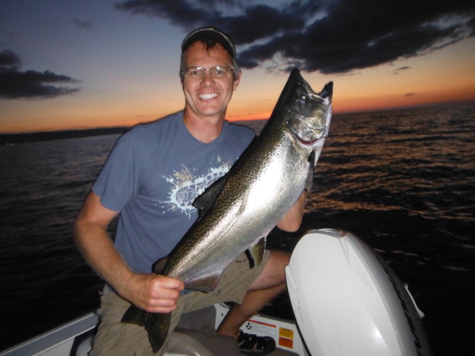 Fred Dobbs_ NVCA fisheries biologist with Chinook salmon