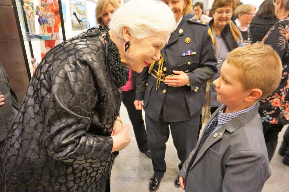 Lt.-Gov. Elizabeth Dowdeswell presents John Perry with a crest pin during her visit to Collingwood this week, recognizing his work with the Georgian Triangle Humane Society and other community causes. Jessica Owen/CollingwoodToday            