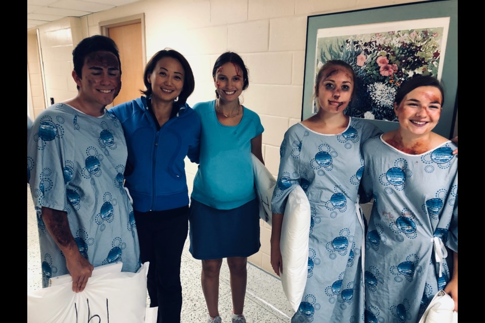 Collingwood's Dr. Cheng (second from left) is pictured here with some of the trauma victims participating in the advanced trauma training course this weekend. Contributed photo