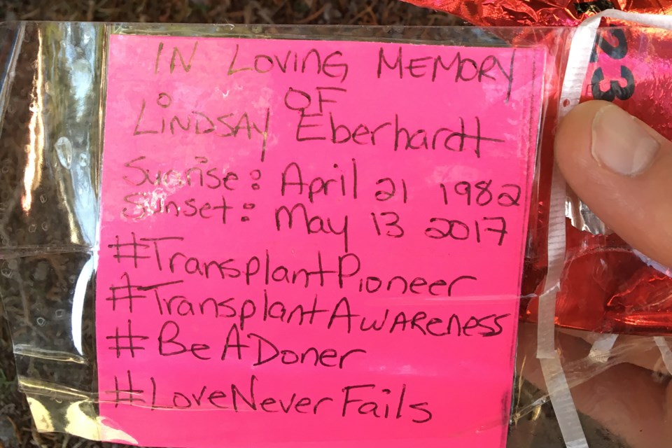 These notes were attached to 50 red heart-shaped balloons released from Sunset Point on April 21 in memory of Lindsay Eberhardt. Jordan Sykes Photo 