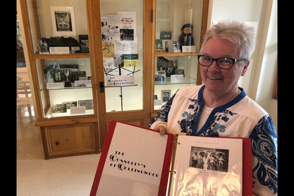 Jane Coxon stands in front of the display case showing her family (The Connolly's) photos and things from their life in Collingwood. Erika Engel/CollingwoodToday