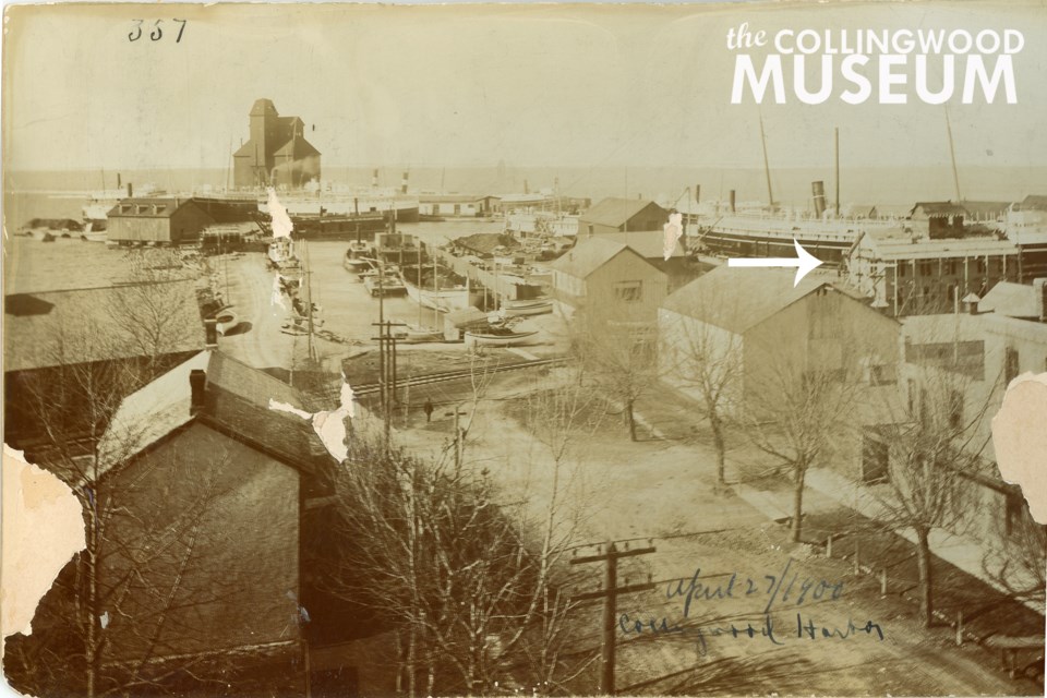 This photograph dated 1900 appears to show construction or renovation of the white two-and-a-half storey building. Photo contributed by Collingwood Museum. Huron Institute 357 and 895, Collingwood Museum Collection X969.240.1, X974.758.1