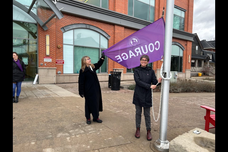Mayor Yvonne Hamlin and My Friend's House executive director Alison FitzGerald raise the Courage flag to launch My Friend's House annual fundraising and awareness campaign. 