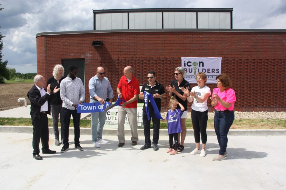 Town staff, design and build crews, town council, and members of the Collingwood United Soccer Club cut the ribbon to officially open the Fisher Field washroom and changeroom building. 
