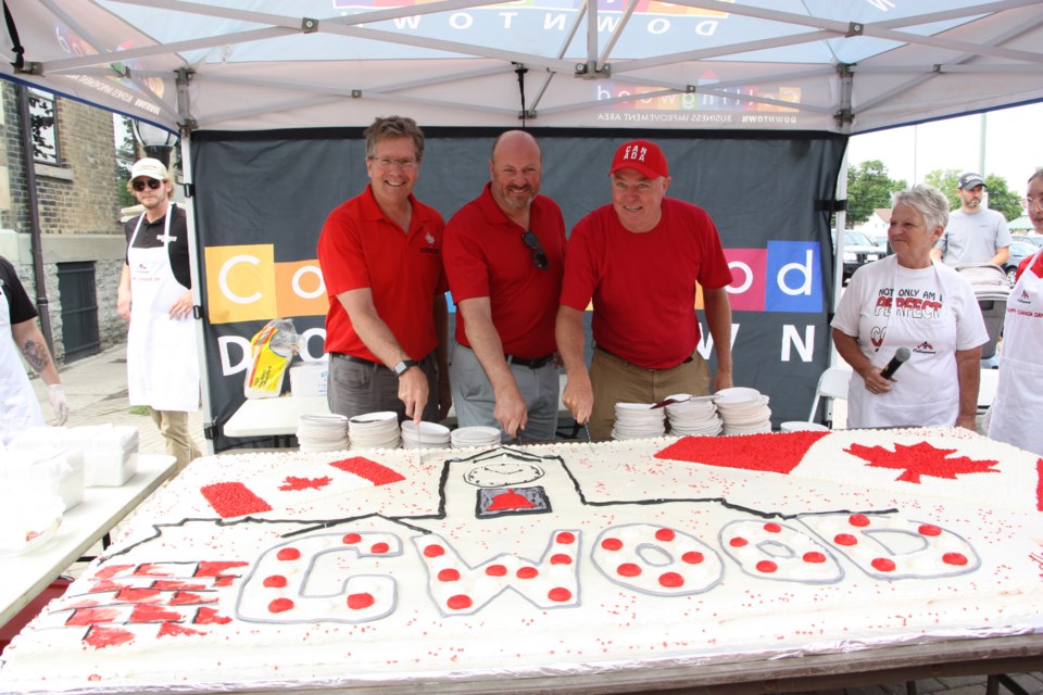 Loblaw grocery store donated the giant Canada Day cake, as they have done in many previous years. MPP Brian Saunderson, Acting Mayor Keith Hull, and MP Terry Dowdall made the first cuts into the cake before it was served following the citizenship reaffirmation ceremony. 