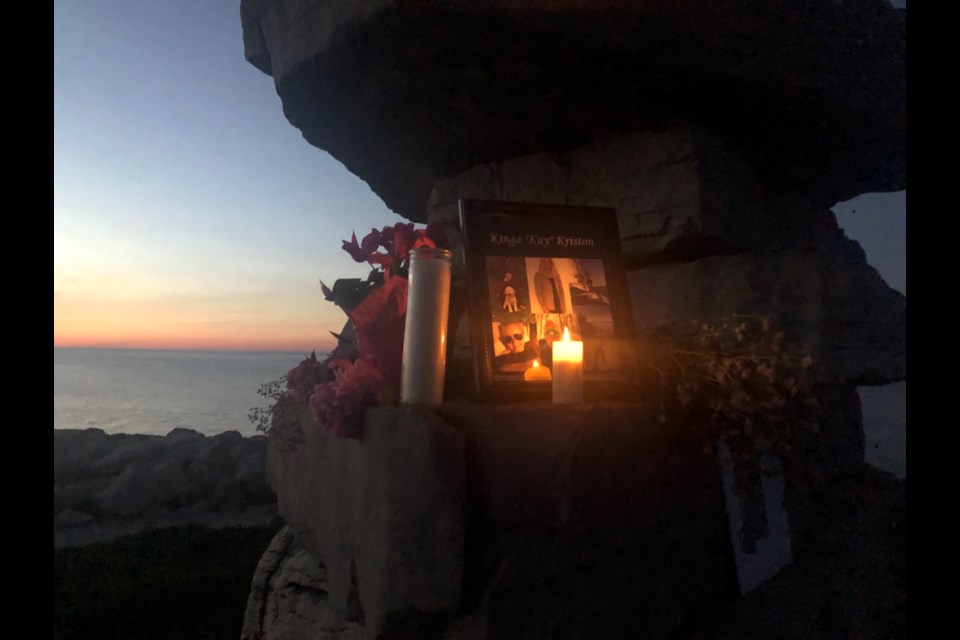 Items left on the Inukshuk at Sunset Point by those grieving the death of Kay Kriston. 