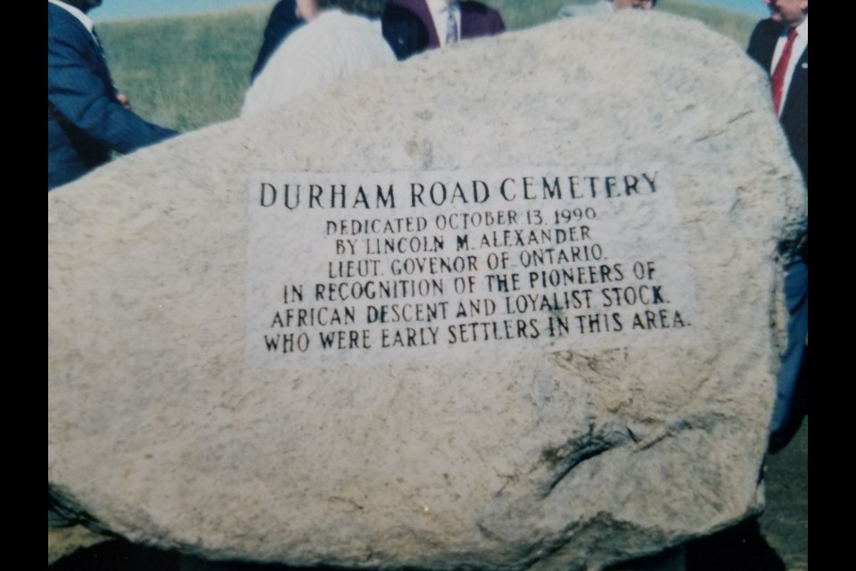 The engraved stone that marks the Old Durham Road cemetery. 