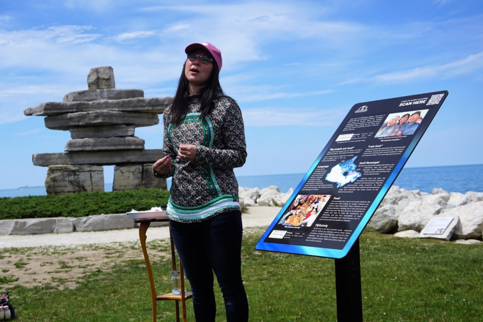Muckpaloo Ipeelie participates in an unveiling gathering at the Inuksuk at Sunset Point Park on June 24, 2022.