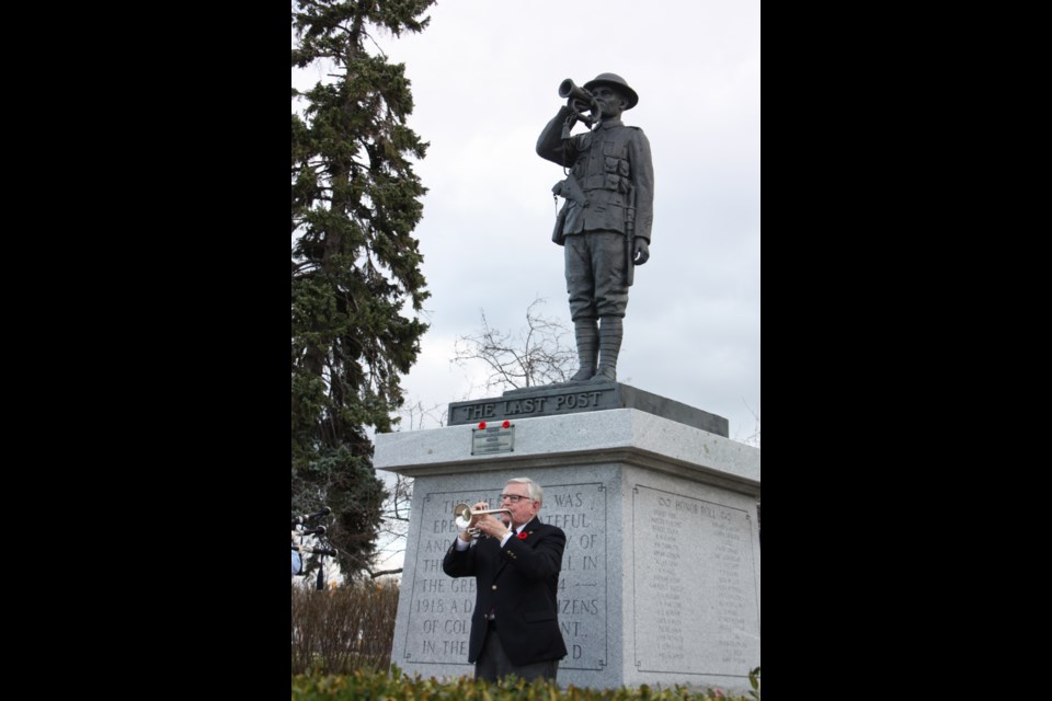 Don Doner plays the Last Post under the Collingwood Cenotaph statue of the same name. Nov. 11, 2020. Erika Engel/CollingwoodToday