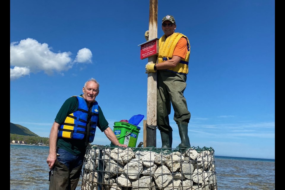 Bob Woodcock and Robert Turner took their annual trip to the island off Northwinds Beach to raise the Canadian Flag. This year, they've added the Ukranian flag too, in solidarity with the nation that was attacked by Russia this year. 