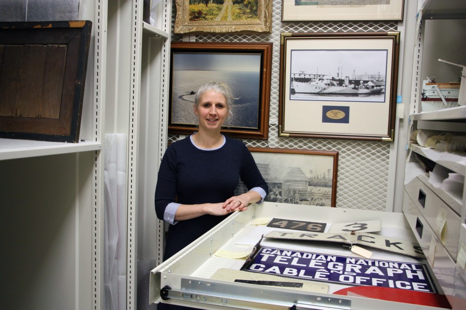 Melissa Shaw, museum assistant at the Collingwood Museum, shows a drawer full of signs obtained from the former Collingwood train station. They are currently being kept in the large object storage room at the Collingwood Museum. Erika Engel/CollingwoodToday