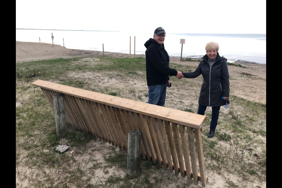 Jack Marley thanks Nancy Ludlow for finding a railing on Wasaga Beach that had been carried away from a trail in Collingwood. Erika Engel/CollingwoodToday