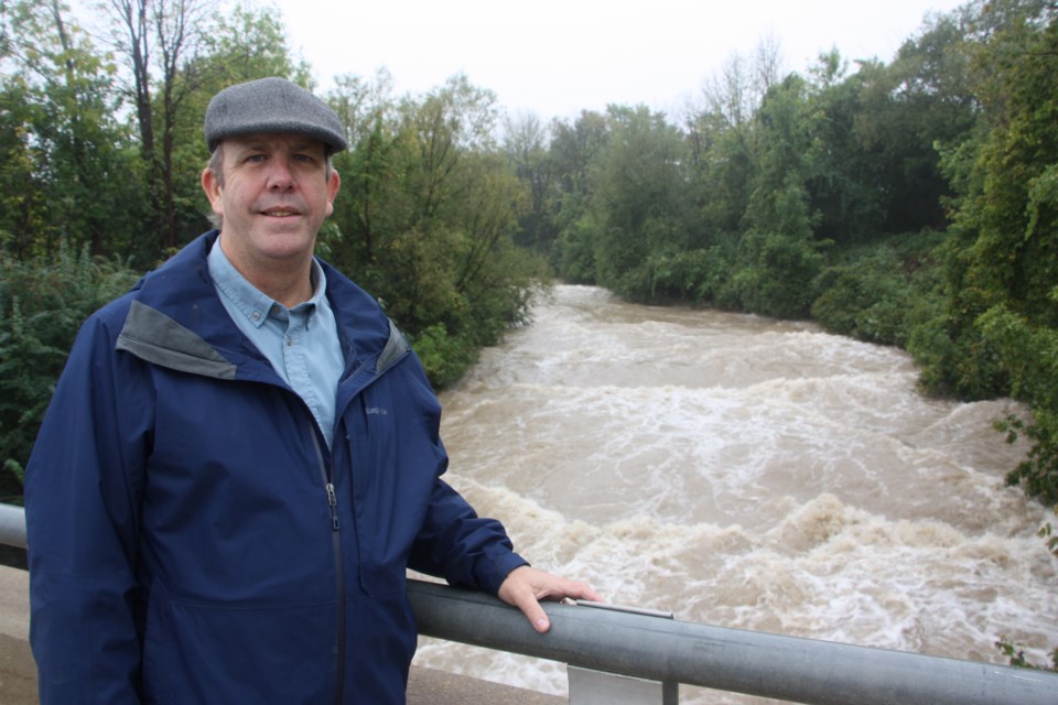 NVCA Senior Engineer Mark Hartley on the Pretty River Parkway bridge on Thursday, Sept. 26, during one of the highest river flow days since 2006. 