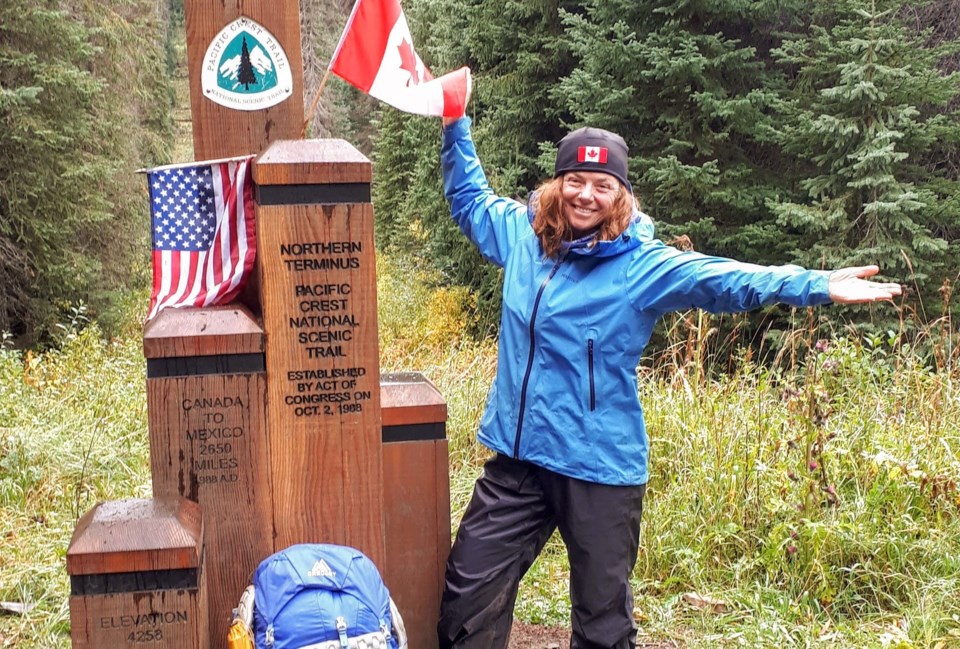 linda at PCT Northern Terminus