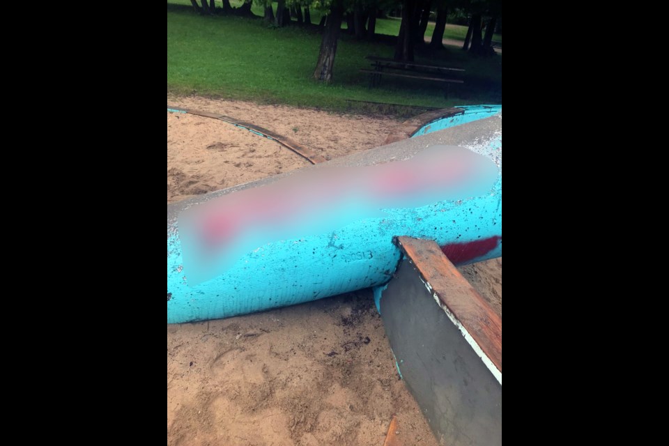 The graffitti has been blurred because of the racist, profane content included. This was one of many playground structures tagged overnight with racist, homophobic, violent, profane messages and images. 