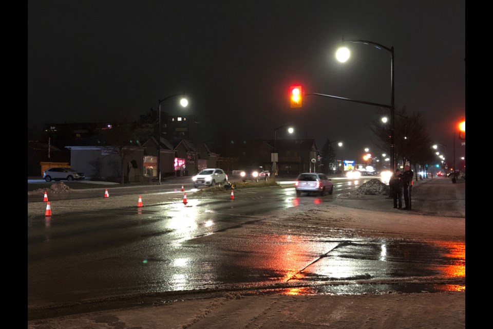 The traffic light (left) was levelled after a woman who has been charged with impaired driving, crashed into it last night around 6 p.m. Erika Engel/CollingwoodToday