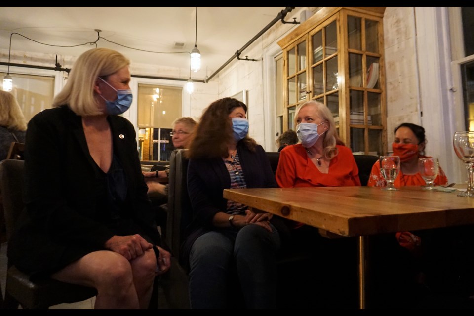 Simcoe-Grey Liberal candidate Bren Munro (left) watches the election night results come in with her supporters in Creemore on Sept. 20, 2021.