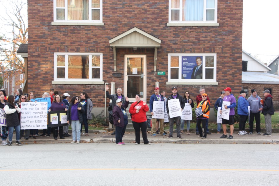 Members of two unions representing education workers demonstrated outside of MPP Brian Saunderson's office in Stayner on Nov. 4 as part of a nationwide strike.