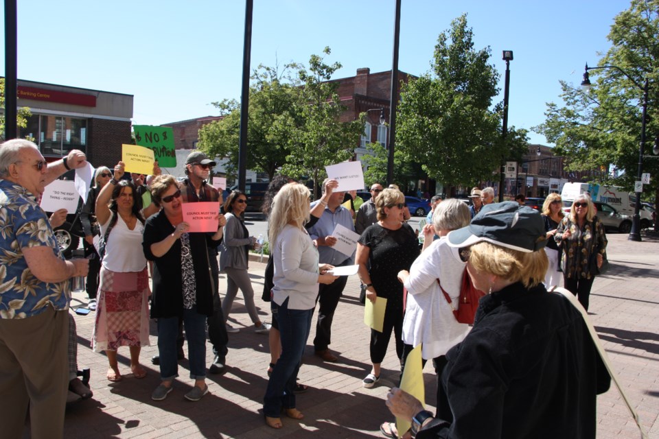 Protestors rally in front of town hall calling for answers related to the Sprung structure purchase in 2012 in light of recent allegations outlined in an OPP document submitted to the courts. Erika Engel/CollingwoodToday
