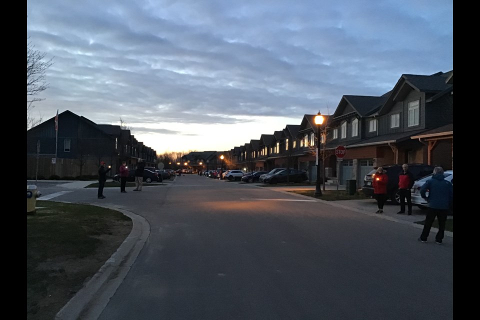 Residents at Silver Glen Preserve stood at the end of their driveways with candles during a vigil last night to mourn the victims of the Nova Scotia shooting. Contributed photo