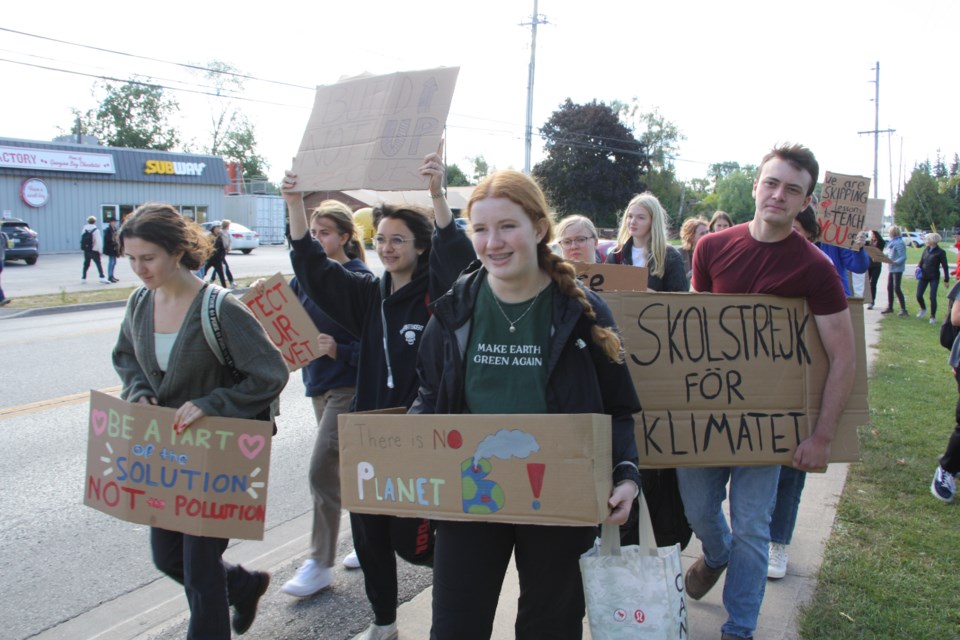 Students walk toward town hall for the climate strike, which was part of a global day of action led by Fridays for Future.