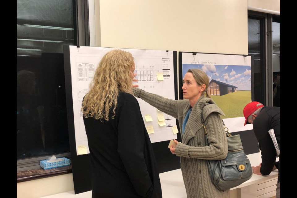 Collingwood's manager of parks, Wendy Martin, speaks with a resident about a plan for a change room and washroom facility at Fisher Field. Erika Engel/CollingwoodToday