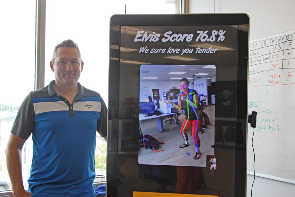 Barry Morwood, CEO of Smash Reality, shows off the current high-score (me) on the Fit to be King kiosk. Erika Engel/CollingwoodToday