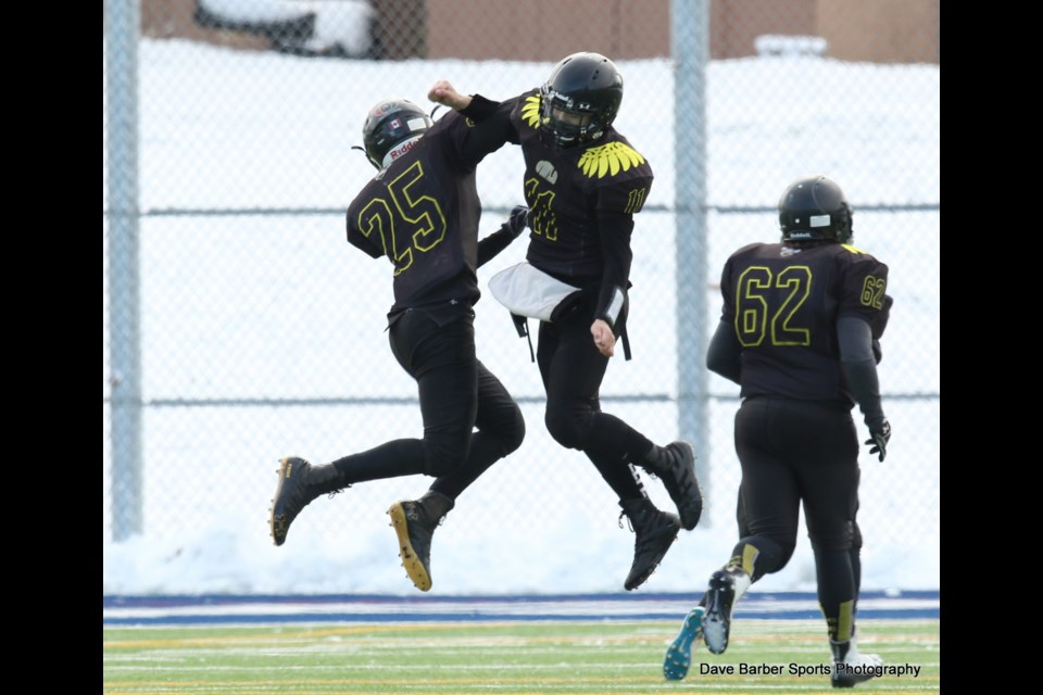 Fighting Owls teammates celebrate mid-air during the SCAA game Nov. 7. Photo by Dave Barber Sports Photography