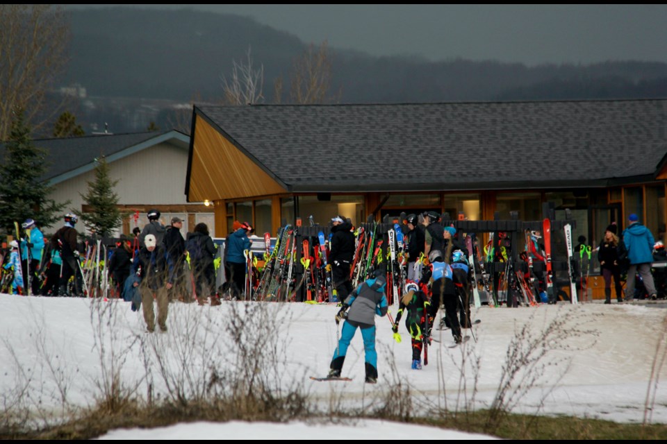 Skiers, coaches and spectators taking part in the OFSAA Alpine competition headed indoors after lightning was flashing in the sky over Osler Bluff Ski Club Tuesday morning.