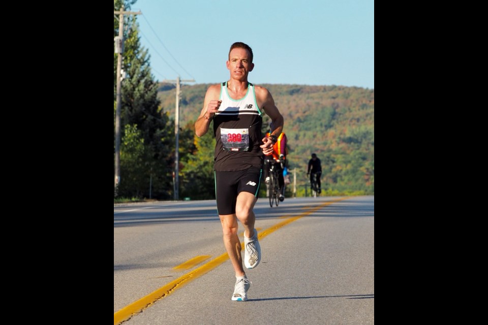 Reid Coolsaet runs the 10-km event in the Living Water Resorts Collingwood Half-Marathon earlier this month. He set a Canadian Masters record for his age category finishing the race in 30 minutes and nine seconds. Photo by Tjalling Halbertsma