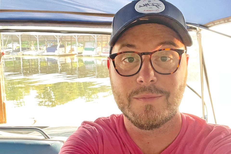 Andrew Bains, a tech entrepreneur who has moved his business out of Toronto to Innisfil, on his boat on Lake Simcoe. | Image supplied