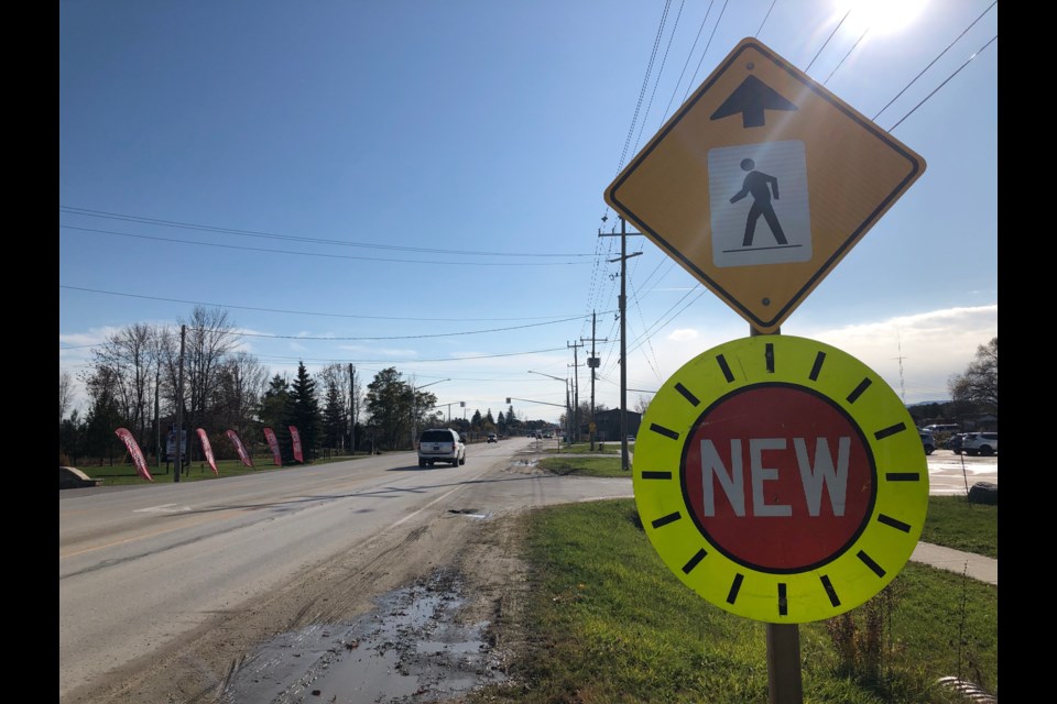 A sign advises drivers of a new light-controlled pedestrian crosswalk on Hurontario Street. Erika Engel/CollingwoodToday
