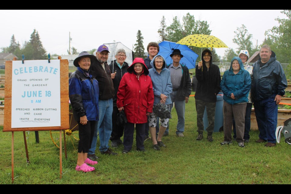 A small crowd braved the rain to celebrate the opening of the new gardens. 