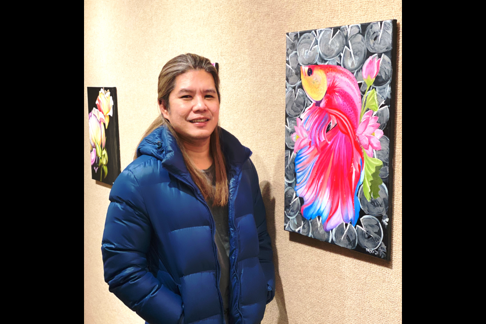 Drixx Salvador stands in front of 'Beta' of his many Philippines-inspired pieces at the Dawson Creek Art Gallery. 