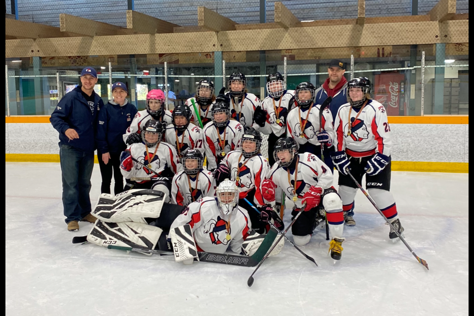 Joe Atkinson (assistant coach), Jodie Atkinson (head coach), Back row: Zoey Lazinchuk, Summer Lazinchuk, Senna Gunsolley, Audrina Freeman, Leau Bijl, Mike Lazenchuk (assistant coach), Cobee Boyd, Centre row: Addison McGuire, Anna Atkinson, Sloan Johnston, Brooke-Lynn Bueckert, Sawyer Smith,  Rosalie Harper-Lauze, Front: Kenzie Bragg (goalie).  