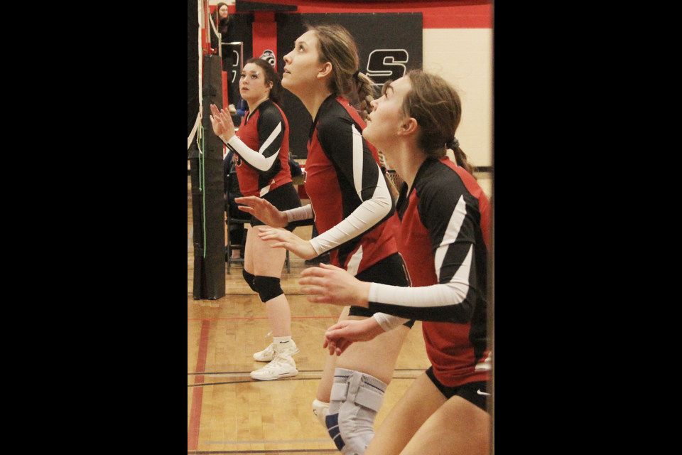 Jadynn Linley, Braelin Wilson, and Jillian Stone during Saturday action at the Mile Zero Meltdown U18 volleyball tournament.