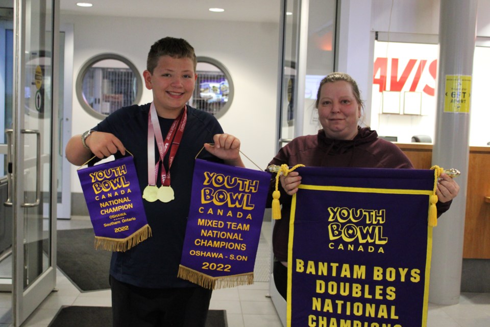 YBC bantam boys (doubles) champion Caleb Waller with coach Karry Riise at the North Peace Airport July 13, 2022 
