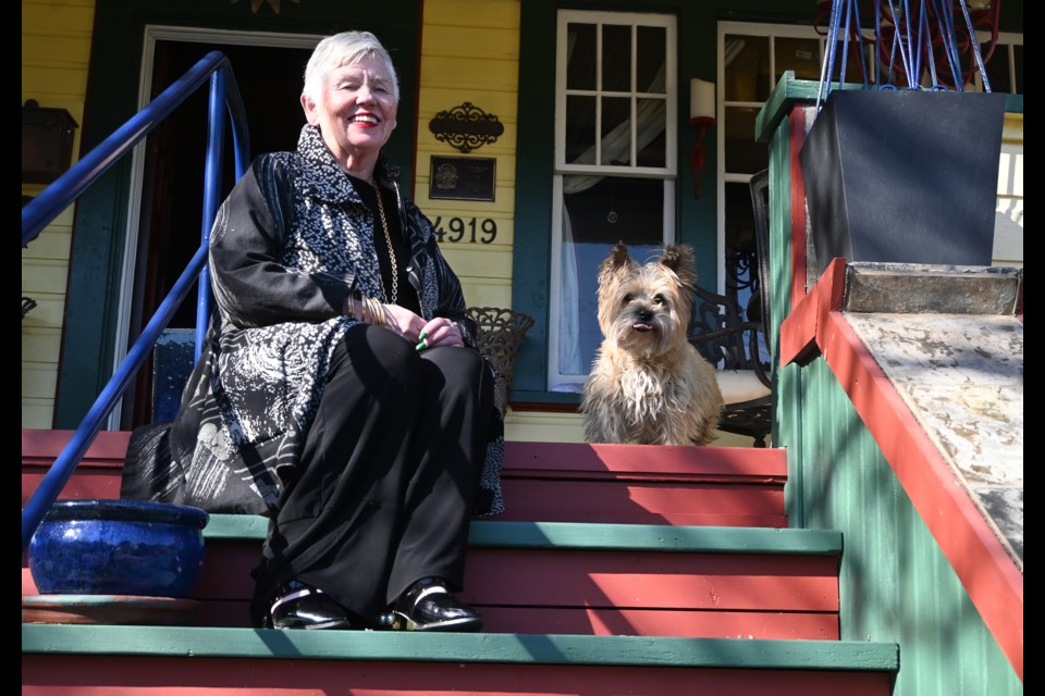 Clair Oates and "Sorcha" on the steps of her Clair's Boutique Hotel which is now closed after a 20-year run in Ladner Village. 