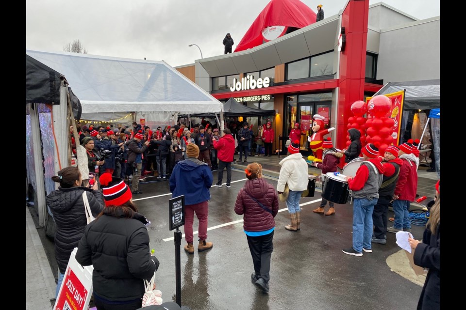 A big crowd didn’t care about the weather as they waited for the Lower Mainland’s newest Jollibee restaurant to open at the Strawberry Hill mall Thursday morning. A DJ played loud music and repeated the opening day promotions including giveaways. 