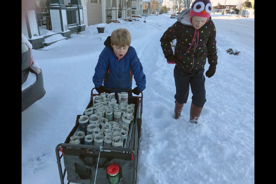 Optimist carriers Charley and Eddie working their way through the snow at Tsawwassen Springs on Thursday.