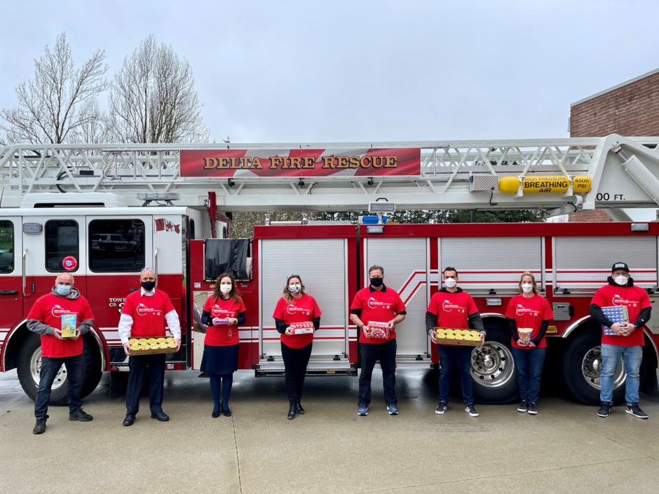 Delta fire group photo by fire truck