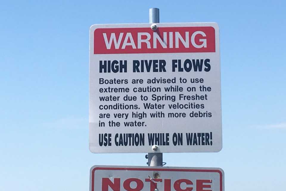 delta flood warning sign